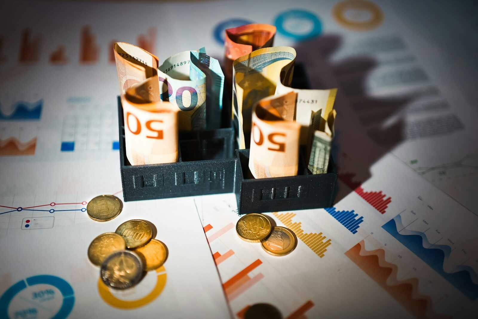 A pile of money sitting on top of a table