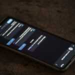 a close up of a cell phone on a table